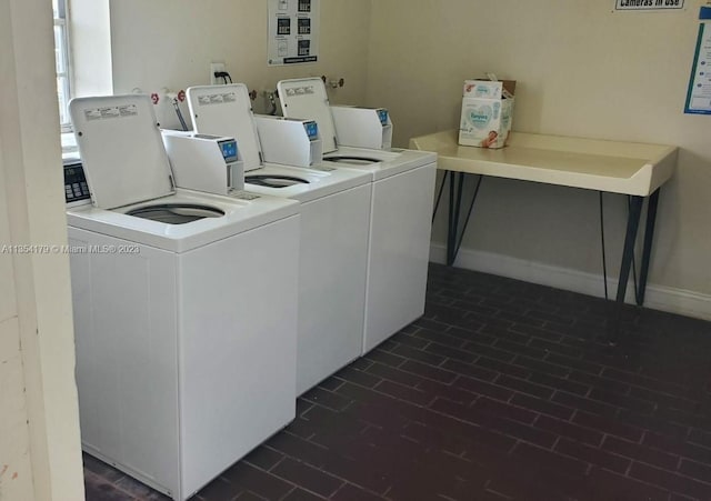 laundry room featuring washing machine and clothes dryer