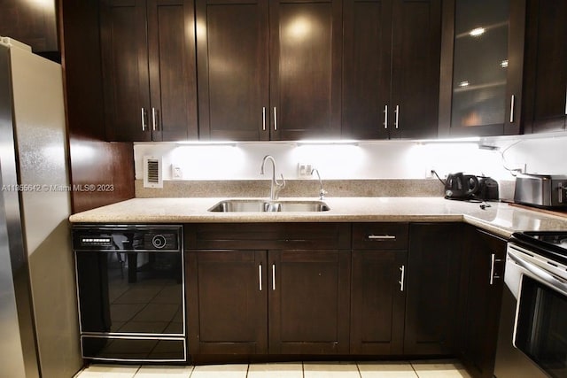 kitchen with sink, dark brown cabinets, dishwasher, light tile flooring, and stainless steel range