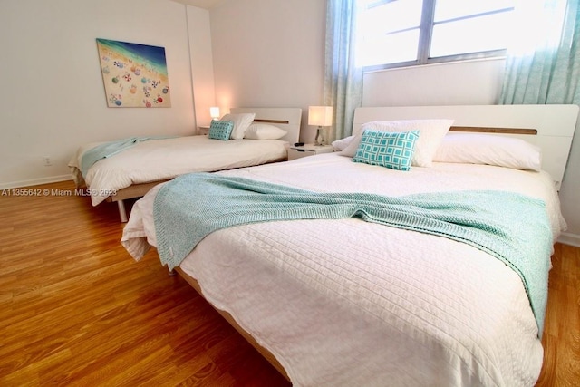 bedroom featuring wood-type flooring