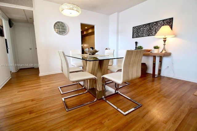 dining space featuring light hardwood / wood-style floors