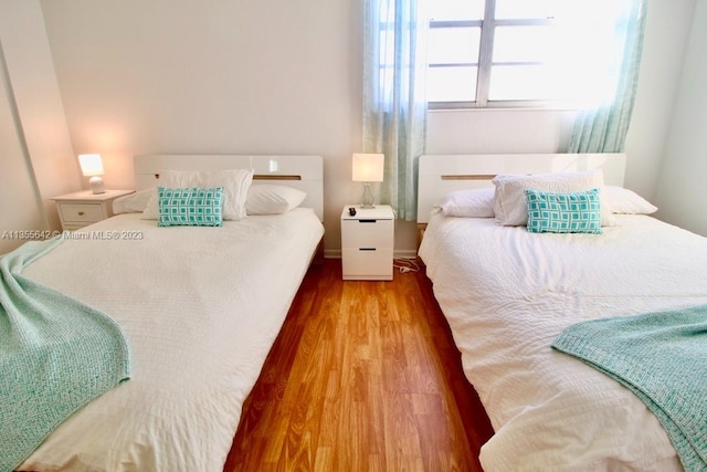 bedroom featuring hardwood / wood-style floors