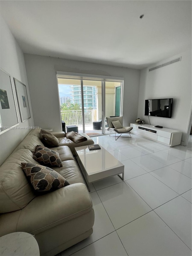 living room featuring light tile flooring