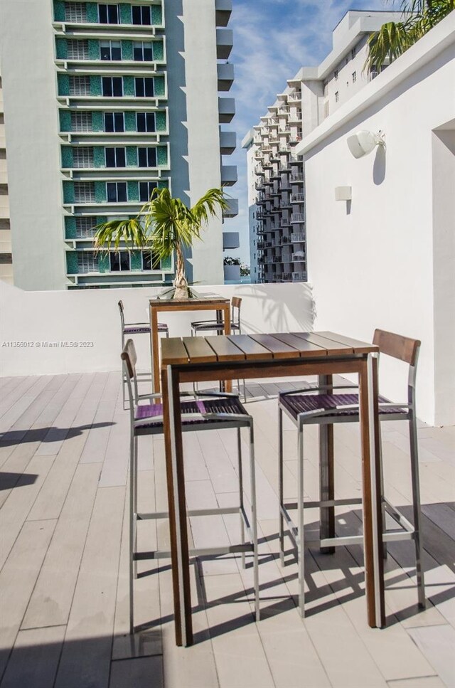 view of patio featuring a balcony