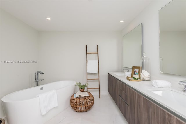 bathroom with double vanity, tile floors, and a bath to relax in