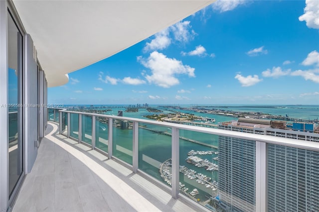 balcony featuring a water view