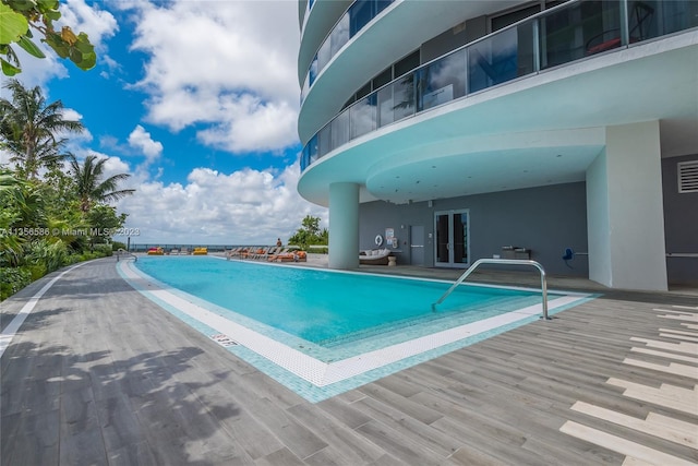 view of swimming pool featuring a patio area