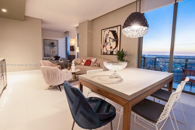 tiled dining space with a notable chandelier and a wall of windows