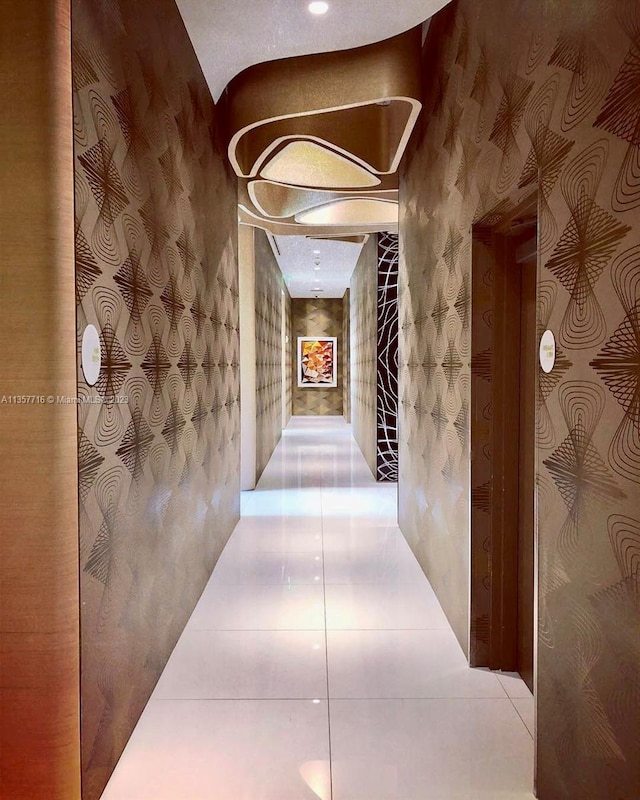 hallway with light tile floors