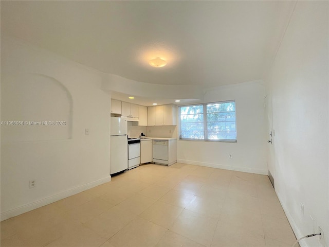 spare room featuring light tile floors