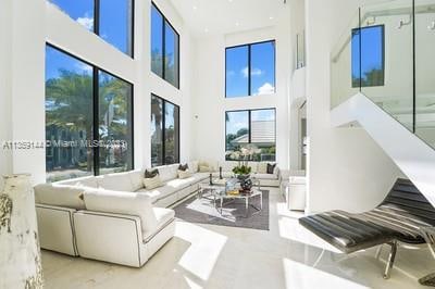 living room featuring a high ceiling