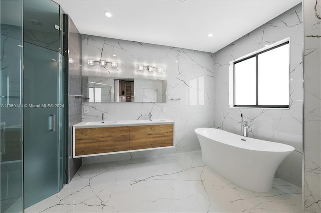 bathroom featuring separate shower and tub and vanity