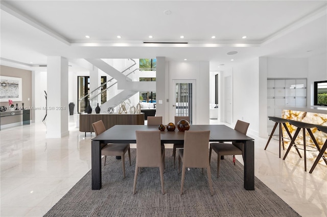 dining room with a raised ceiling