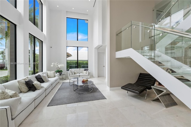 living room with a towering ceiling