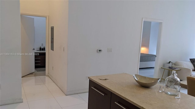 bathroom with tile patterned flooring and electric panel