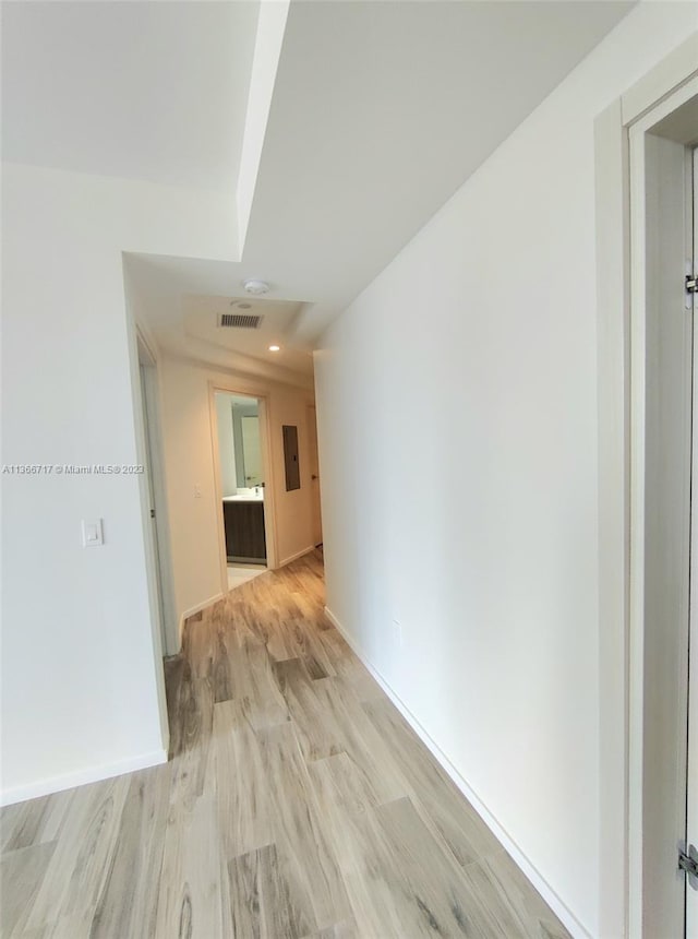 hall with light hardwood / wood-style flooring