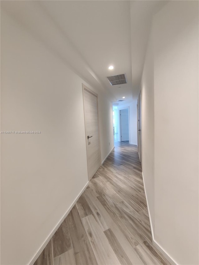 hallway with light wood-type flooring