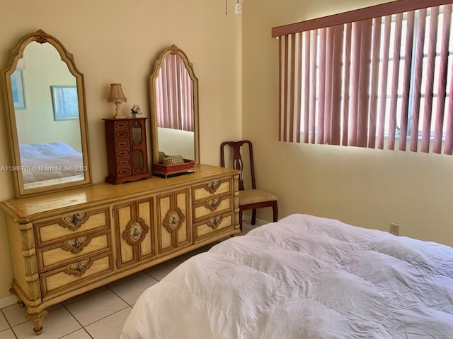 bedroom with light tile floors