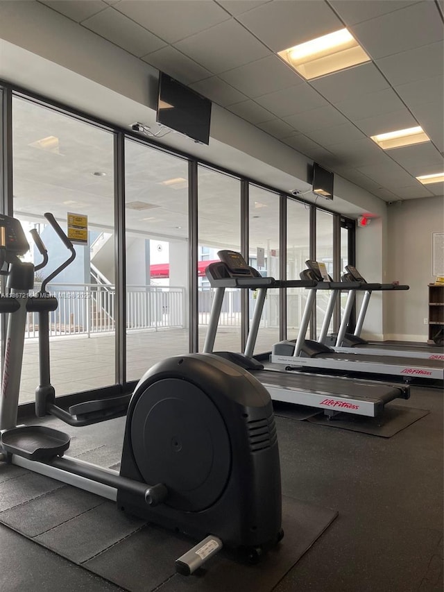 gym featuring a drop ceiling