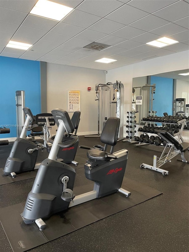 exercise room with a paneled ceiling