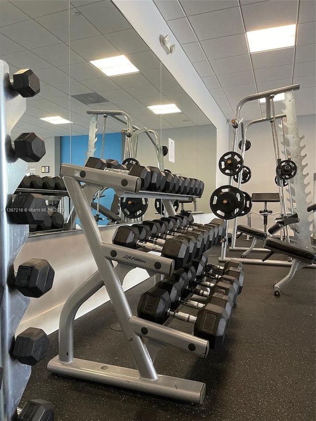 gym featuring a drop ceiling