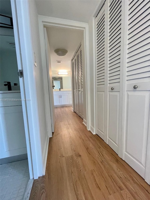 hallway featuring light hardwood / wood-style floors