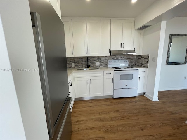 kitchen featuring tasteful backsplash, white cabinetry, sink, dark hardwood / wood-style flooring, and electric stove