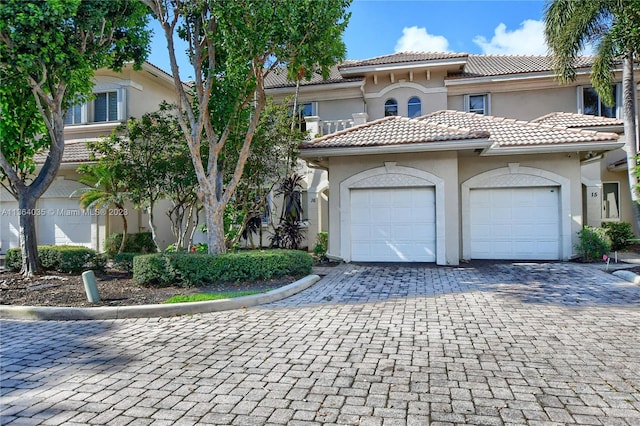 mediterranean / spanish house featuring a garage