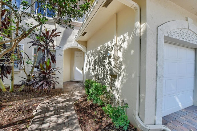 doorway to property featuring a garage