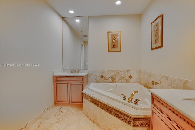 bathroom with tiled tub, vanity, and tile flooring