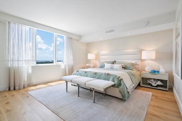 bedroom with light hardwood / wood-style floors