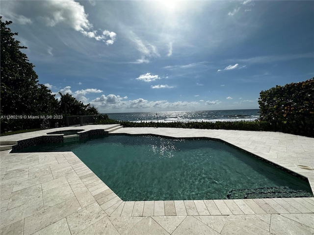 view of pool with an in ground hot tub and a patio