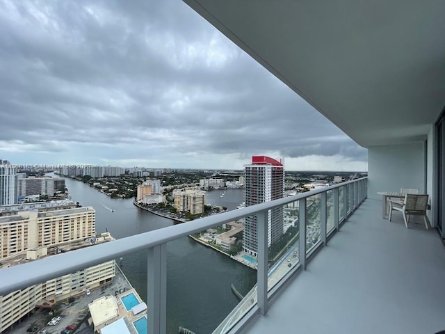 balcony featuring a water view