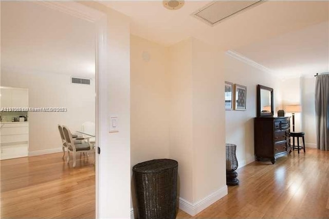 hall with light hardwood / wood-style floors