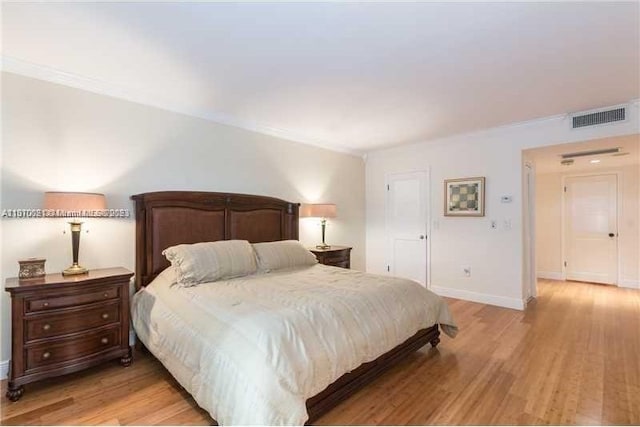 bedroom with light hardwood / wood-style floors