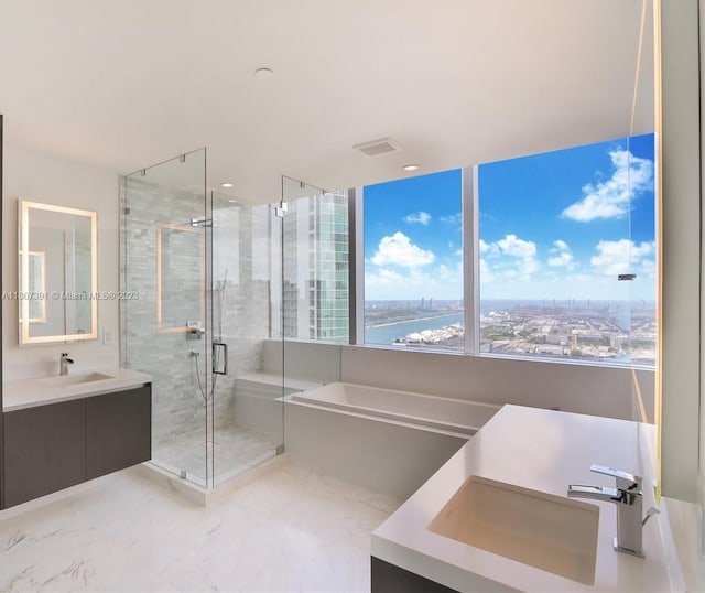 bathroom featuring tile floors, a water view, vanity, and plus walk in shower