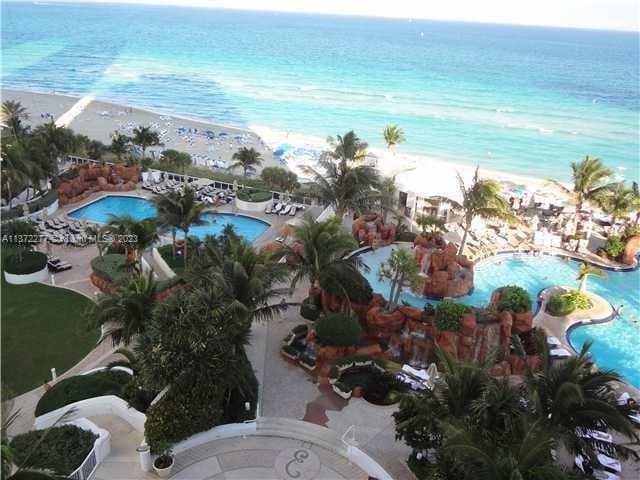 aerial view featuring a beach view and a water view