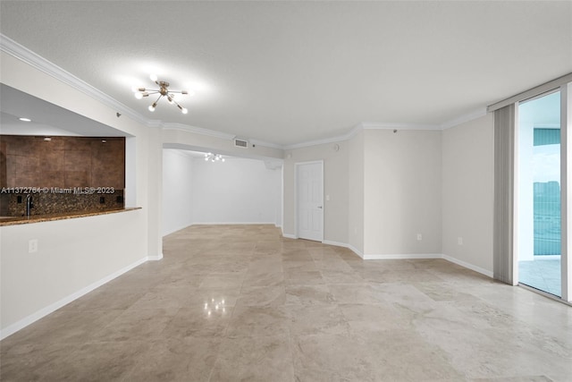 interior space with a textured ceiling and crown molding