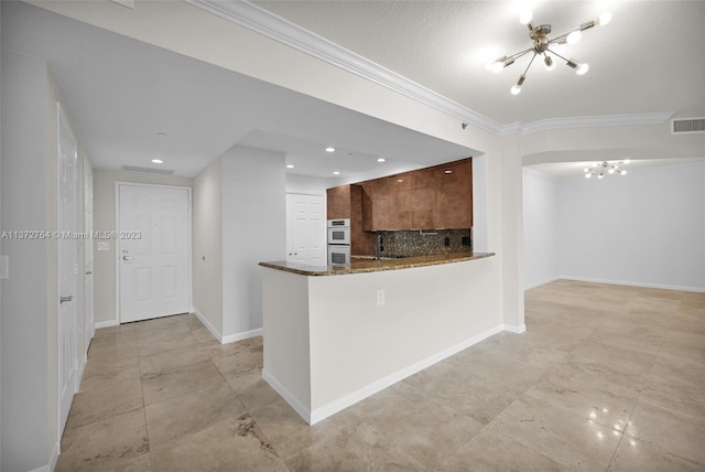 kitchen with light tile flooring, dark stone counters, backsplash, kitchen peninsula, and a chandelier