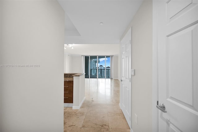 hall with light tile flooring