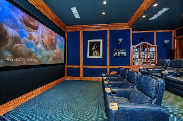 cinema featuring dark colored carpet and crown molding