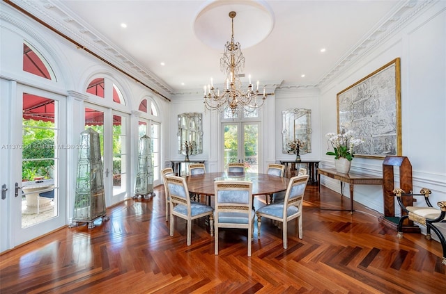 dining room with french doors, dark parquet floors, and a notable chandelier