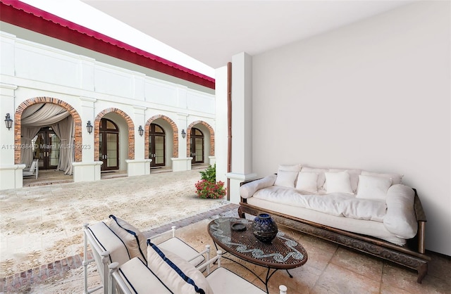 tiled living room with ornate columns