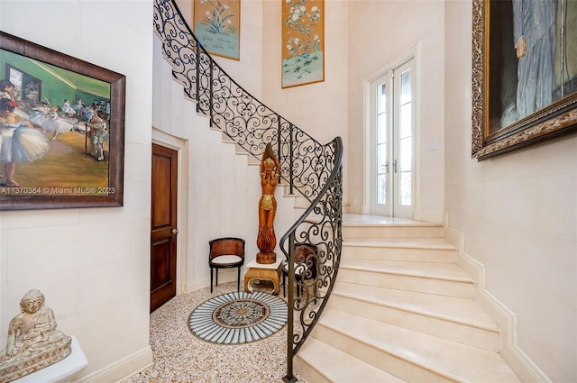 staircase featuring french doors