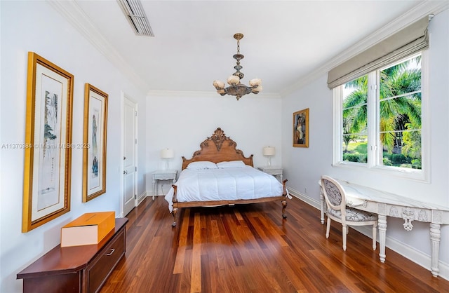 bedroom with dark hardwood / wood-style floors, ornamental molding, and a notable chandelier