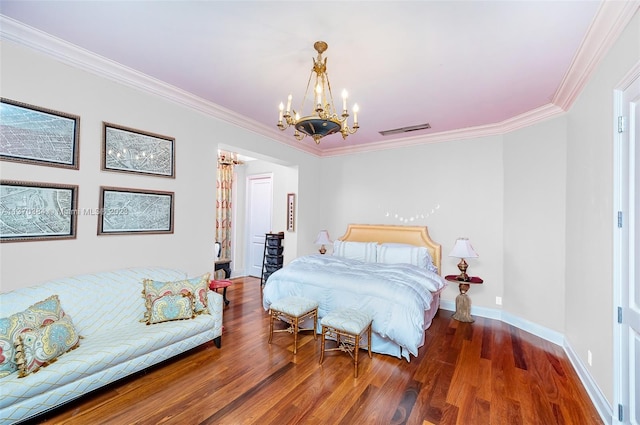 bedroom with ornamental molding, dark hardwood / wood-style floors, and an inviting chandelier