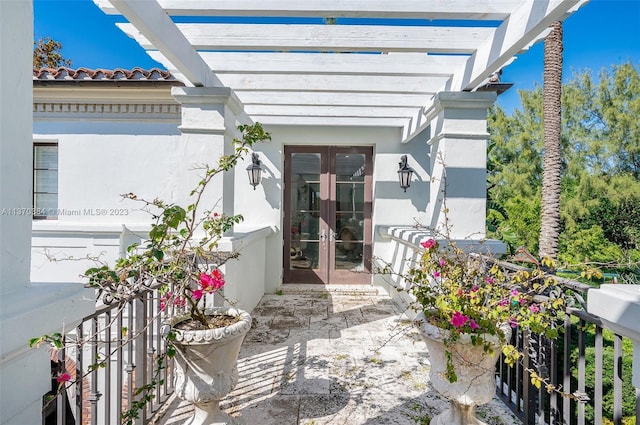 view of patio / terrace with a pergola and french doors