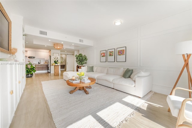 living room with light hardwood / wood-style floors