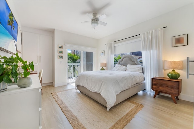 bedroom with ceiling fan and access to exterior