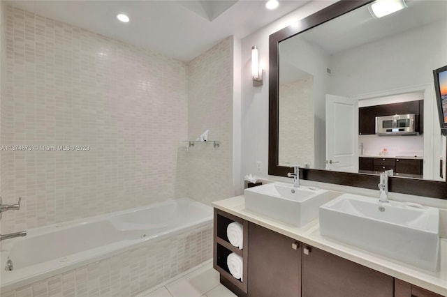 bathroom featuring tiled shower / bath combo, double sink vanity, and tile flooring