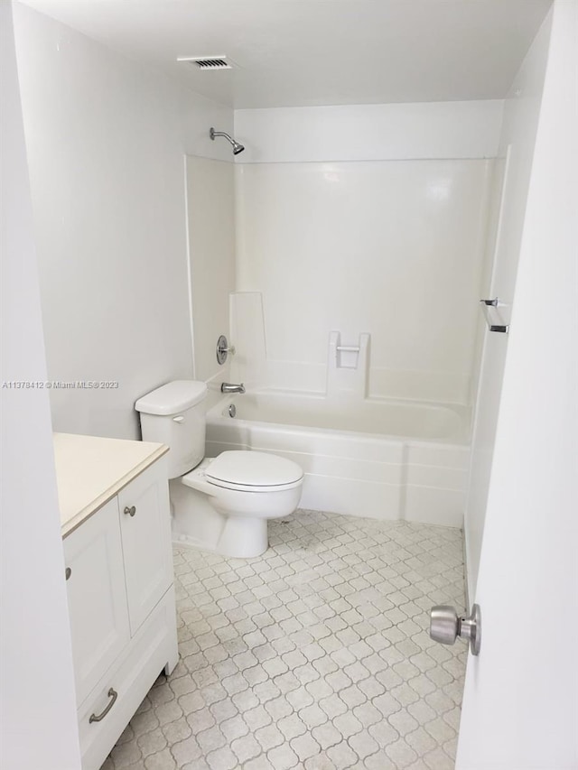 full bathroom featuring  shower combination, toilet, tile flooring, and vanity